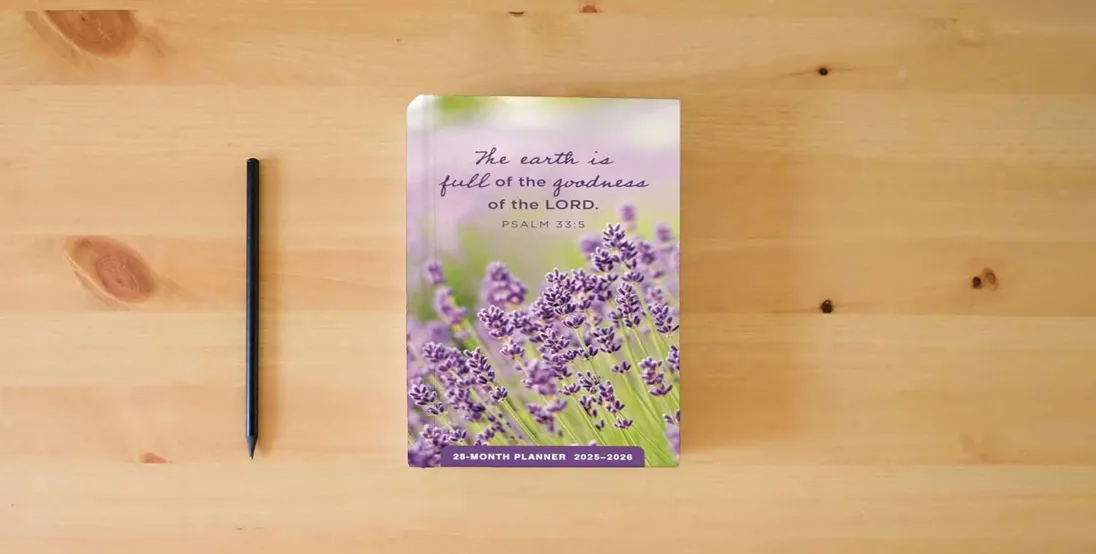 The book Psalms: 2025-2026 28-Month Inspirational Pocket Planner} is on the table