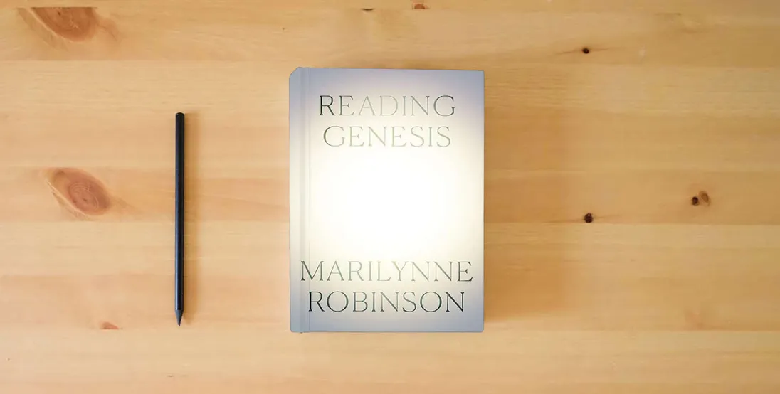 The book Reading Genesis} is on the table