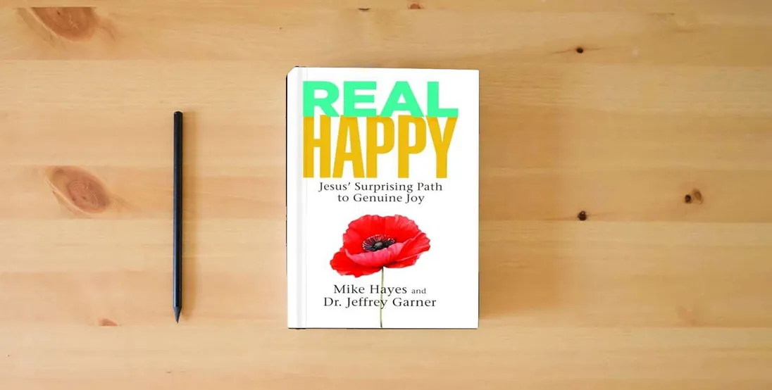 The book Real Happy: Jesus’ Surprising Path to Genuine Joy} is on the table