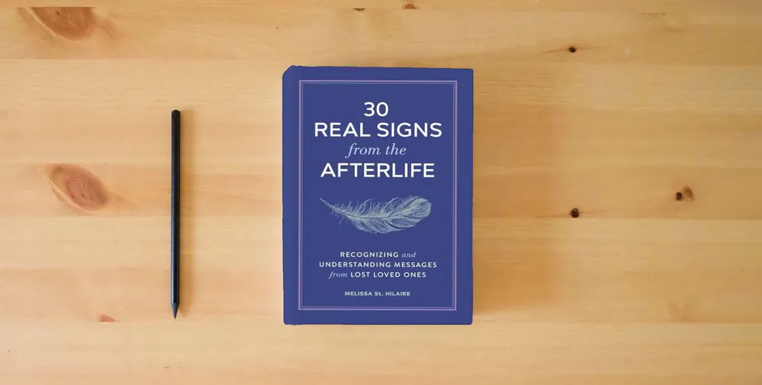 The book 30 Real Signs from the Afterlife: Recognizing and Understanding Messages from Lost Loved Ones} is on the table