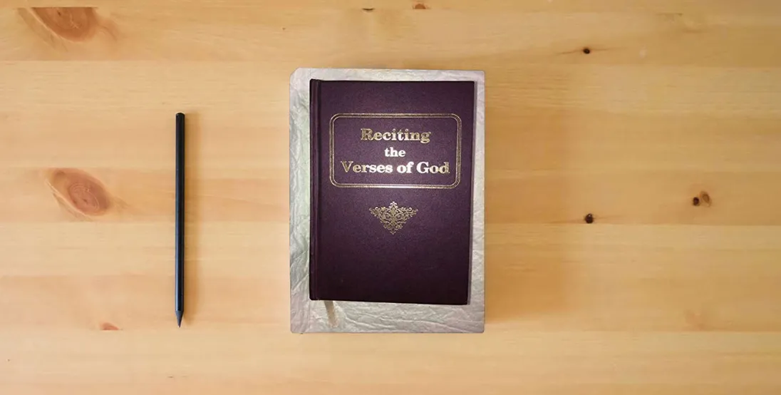 The book Reciting the Verses of God} is on the table