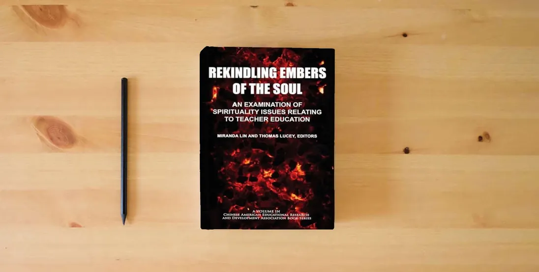 The book Rekindling Embers of the Soul: An Examination of Spirituality Issues Relating to Teacher Education (Chinese American Educational Research and Development Association Book Series)} is on the table