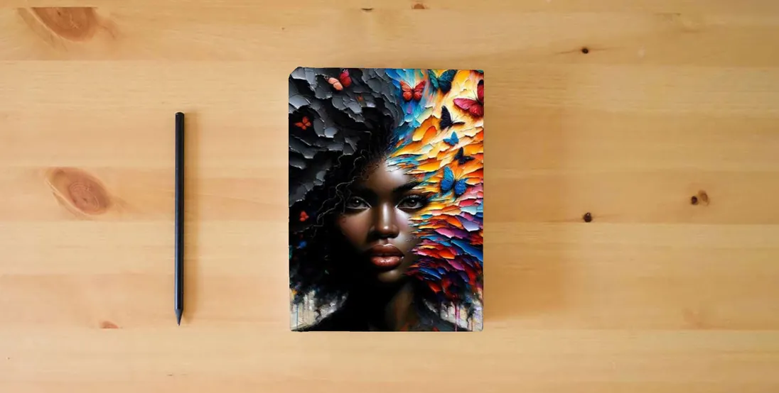 The book Renewed Mind Devotional Journal} is on the table