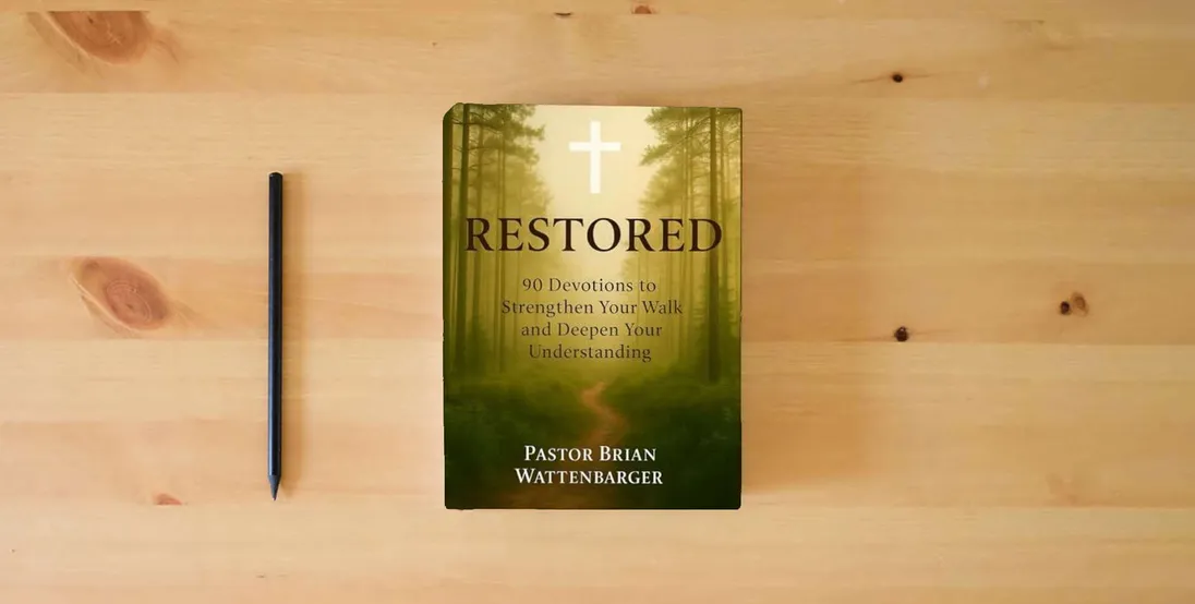 The book RESTORED: 90 Devotions to Strengthen Your Walk and Deepen Your Understanding} is on the table