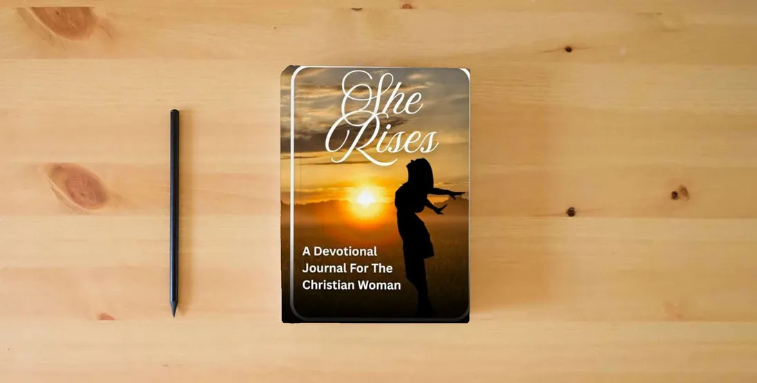 The book She Rises: A Devotional Journal For The Christian Woman} is on the table