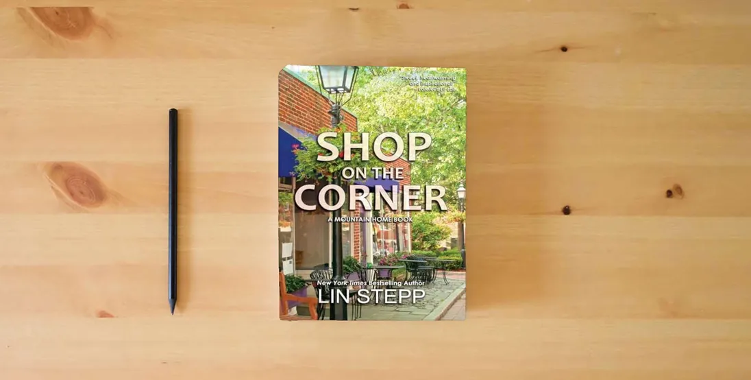 The book Shop On The Corner} is on the table