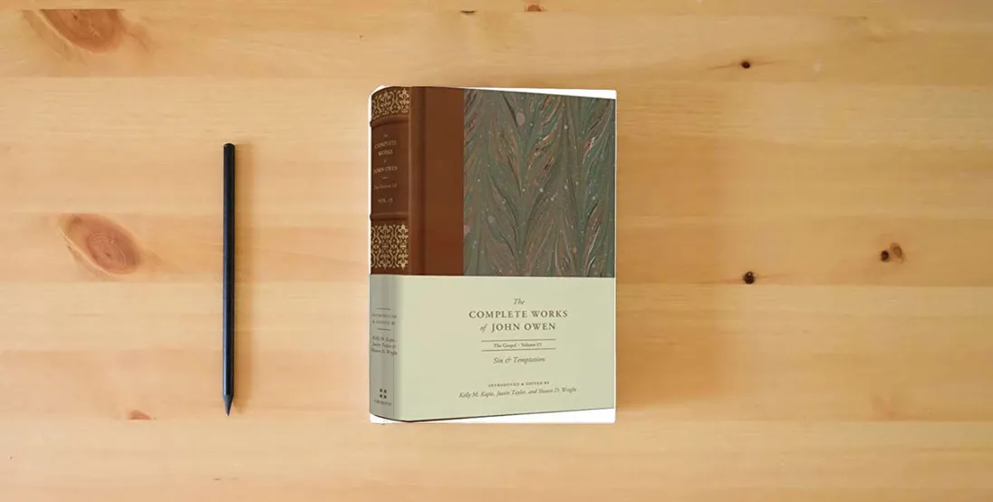 The book Sin and Temptation (Volume 15) (The Complete Works of John Owen)} is on the table