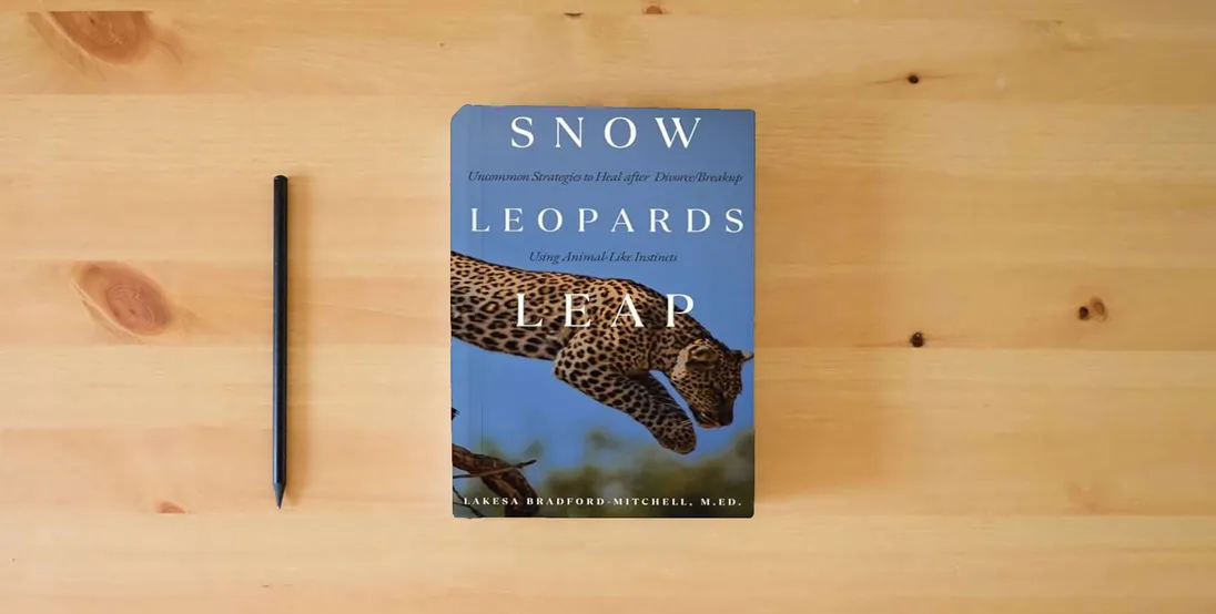 The book Snow Leopards Leap: Uncommon Strategies to Heal after Divorce/Breakup Using Animal-Like Instincts} is on the table
