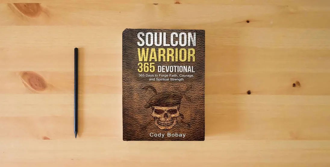 The book Soulcon Warrior 365 Devotional: 365 Days to Forge Faith, Courage, and Spiritual Strength (Soulcon Series)} is on the table