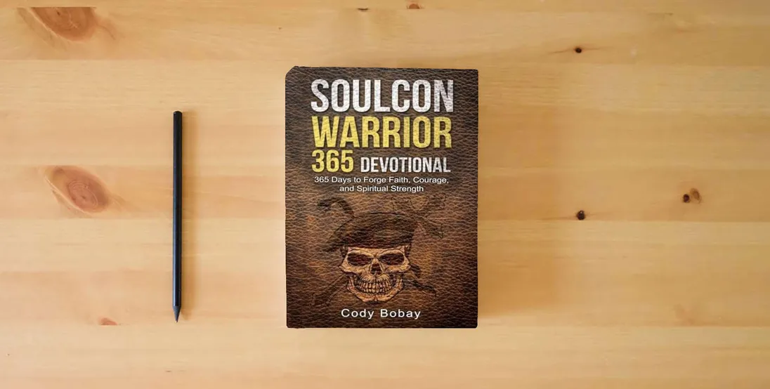 The book Soulcon Warrior 365 Devotional: 365 Days to Forge Faith, Courage, and Spiritual Strength (Soulcon Series)} is on the table