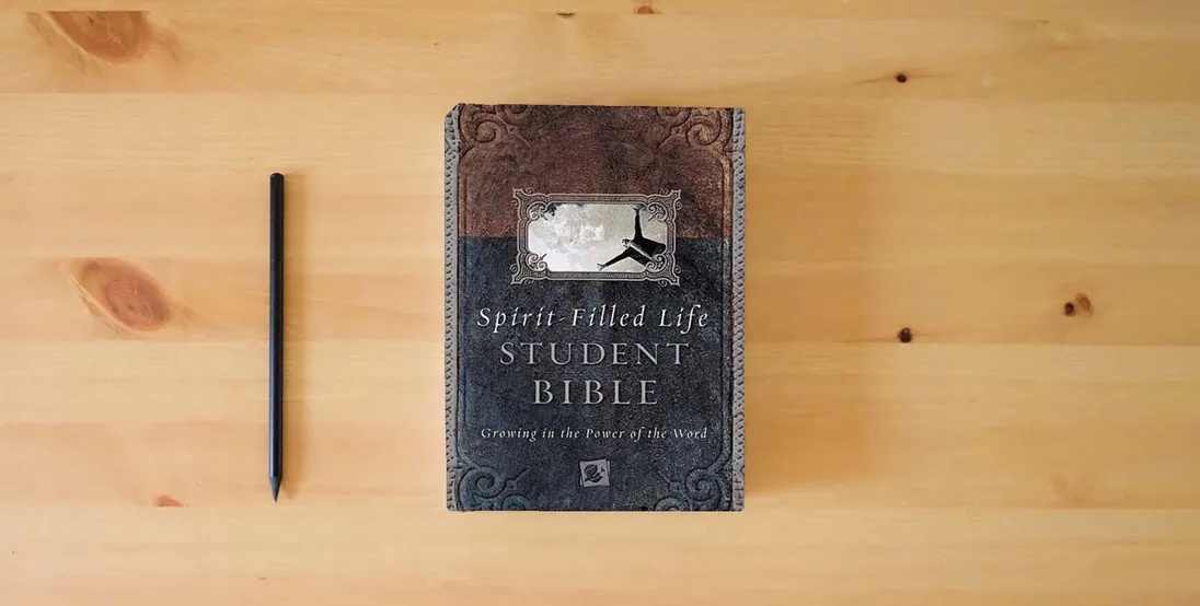 The book Spirit-filled Life Bible For Students Growing In The Power Of The Word} is on the table