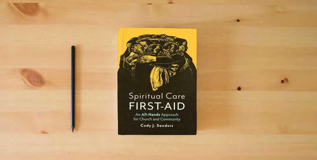The book Spiritual Care First-Aid: An All-Hands Approach for Church and Community} is on the table