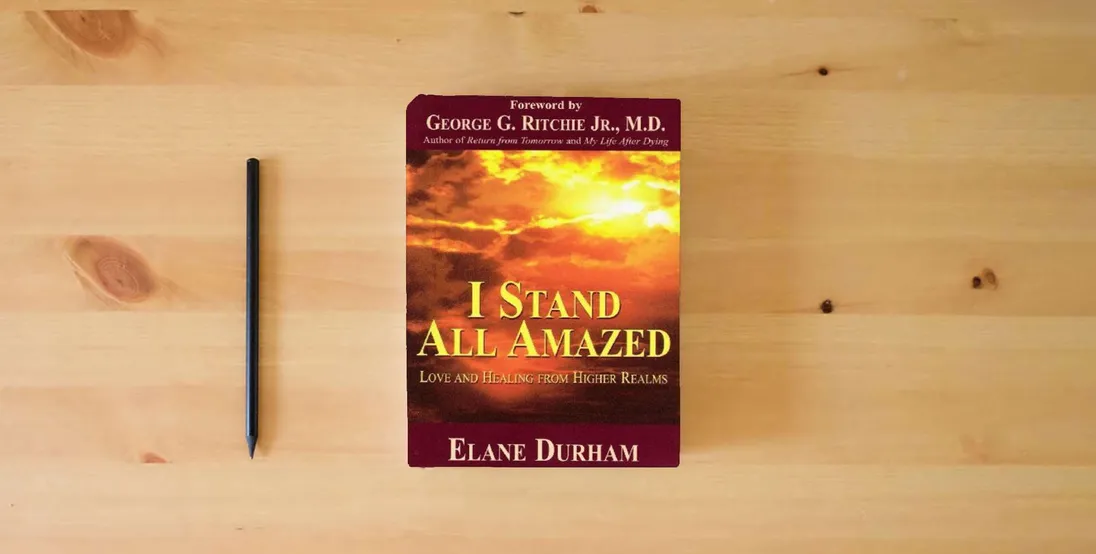 The book I Stand All Amazed: Love and Healing from Higher Realms} is on the table