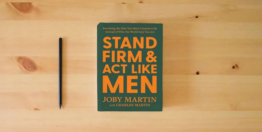 The book Stand Firm and Act Like Men: Becoming the Man You Were Created to Be Instead of Who the World Says You Are} is on the table