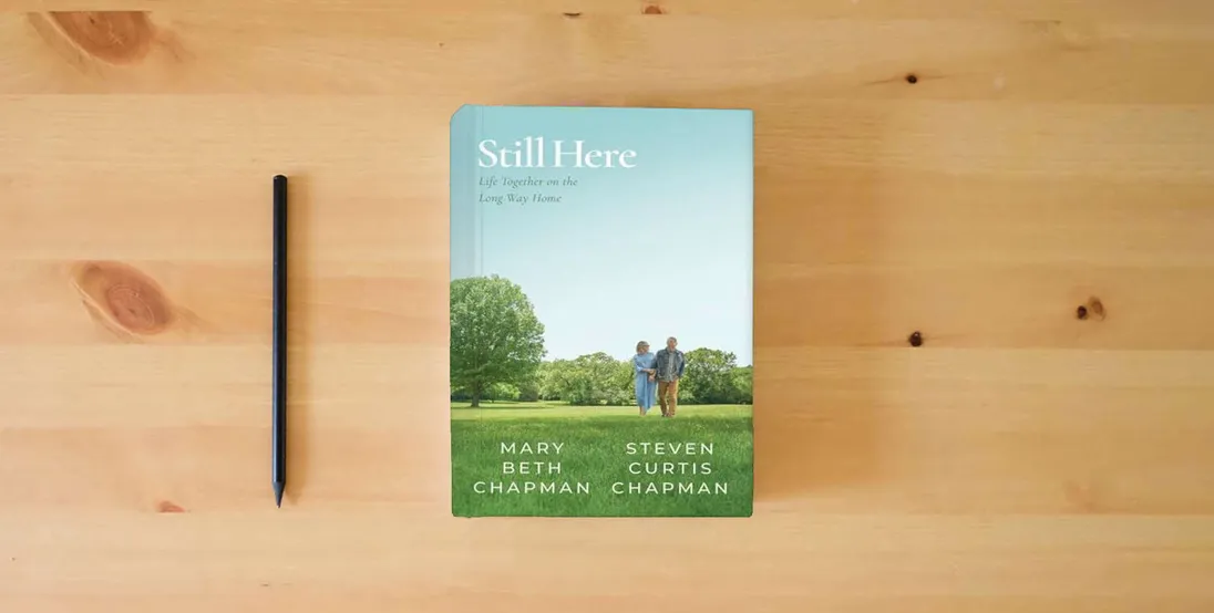 The book Still Here: Life Together on the Long Way Home} is on the table