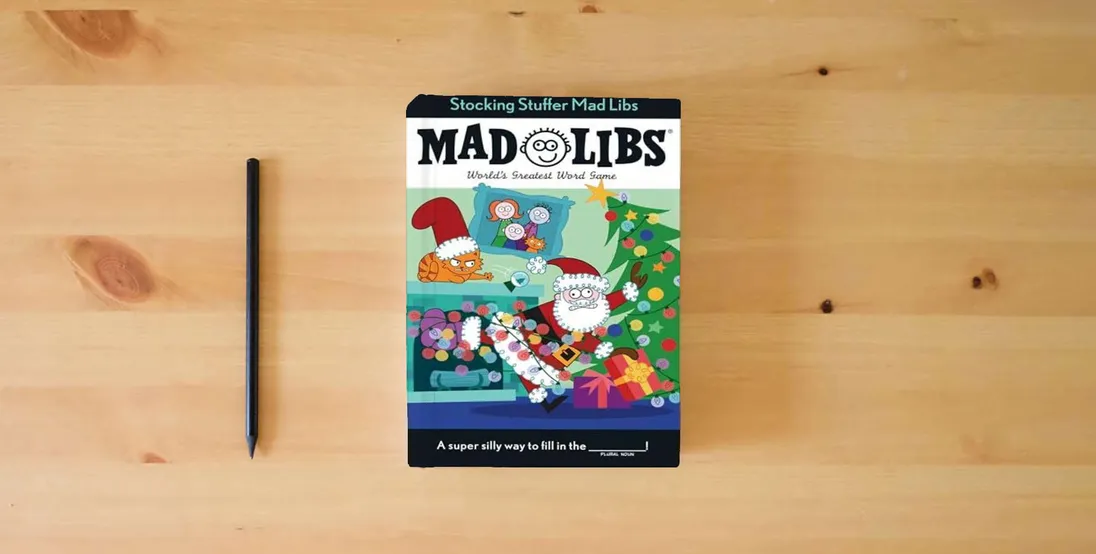 The book Stocking Stuffer Mad Libs: World's Greatest Word Game About Christmas} is on the table