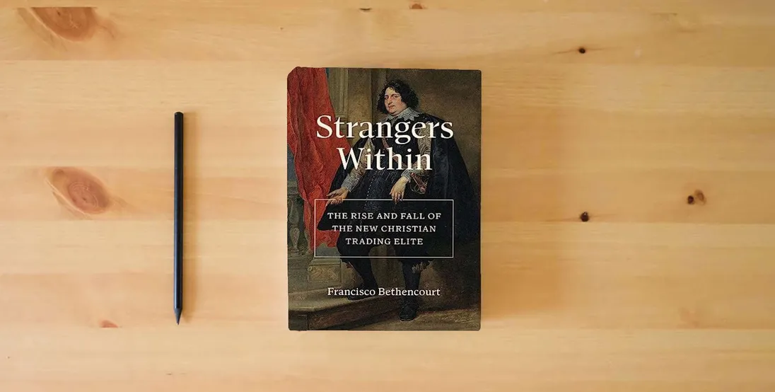 The book Strangers Within: The Rise and Fall of the New Christian Trading Elite} is on the table