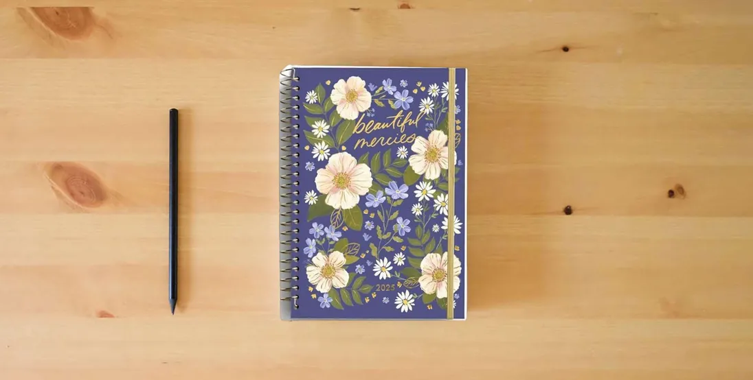 The book Studio 71 – Beautiful Mercies: 2025 12-Month Inspirational Planner} is on the table