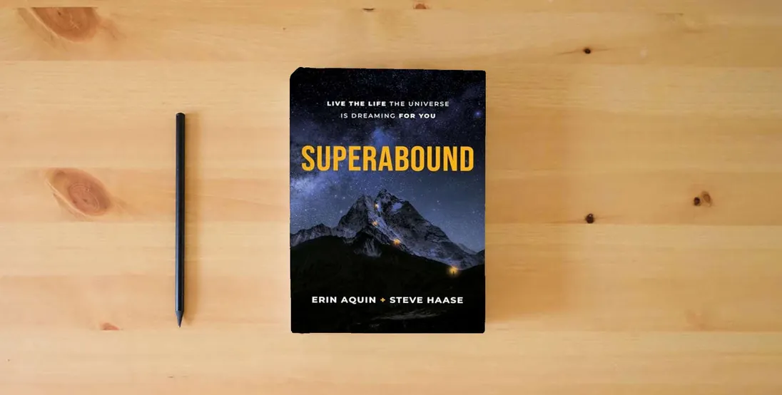 The book Superabound: Live the Life the Universe is Dreaming for You} is on the table