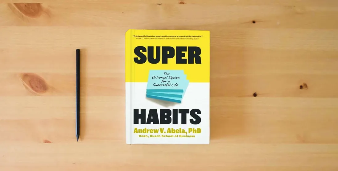 The book Superhabits: The Universal System for a Successful Life} is on the table