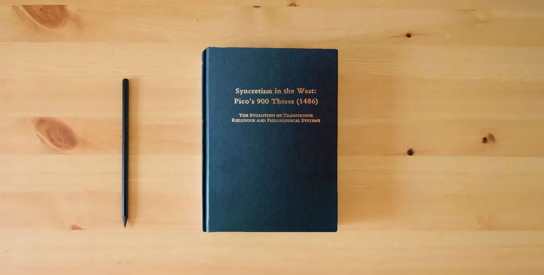 The book Syncretism in the West : Pico's 900 Theses (1486) : The Evolution of Traditional Religious and Philosophical Systems : With a Revised Text, English Translation, and Commentary} is on the table