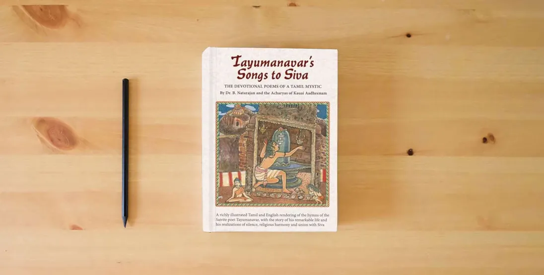 The book Tayumanavar's Songs to Siva: The Devotional Poems of a Tamil Mystic} is on the table