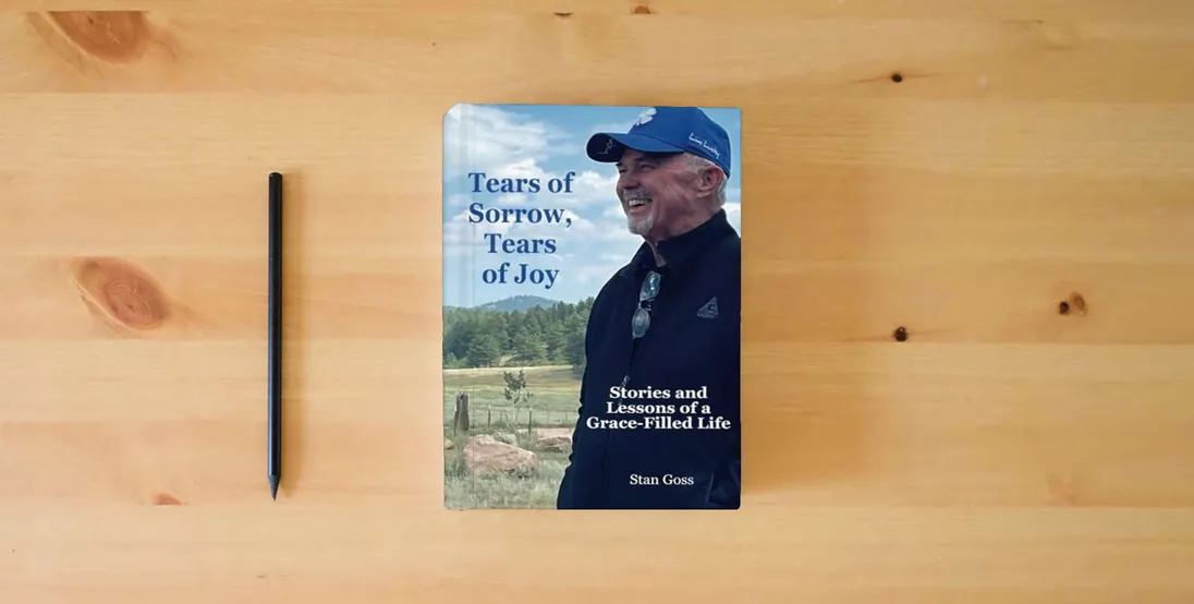 The book Tears of Sorrow, Tears of Joy: Stories and Lessons of a Grace-Filled Life} is on the table