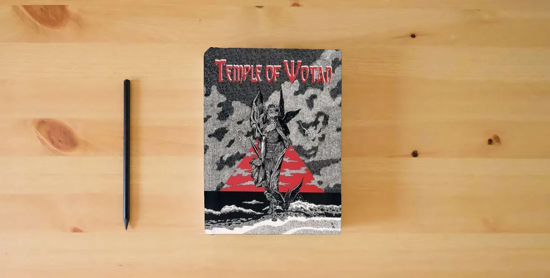 The book Temple of Wotan : Holy Book of the Aryan Tribes} is on the table
