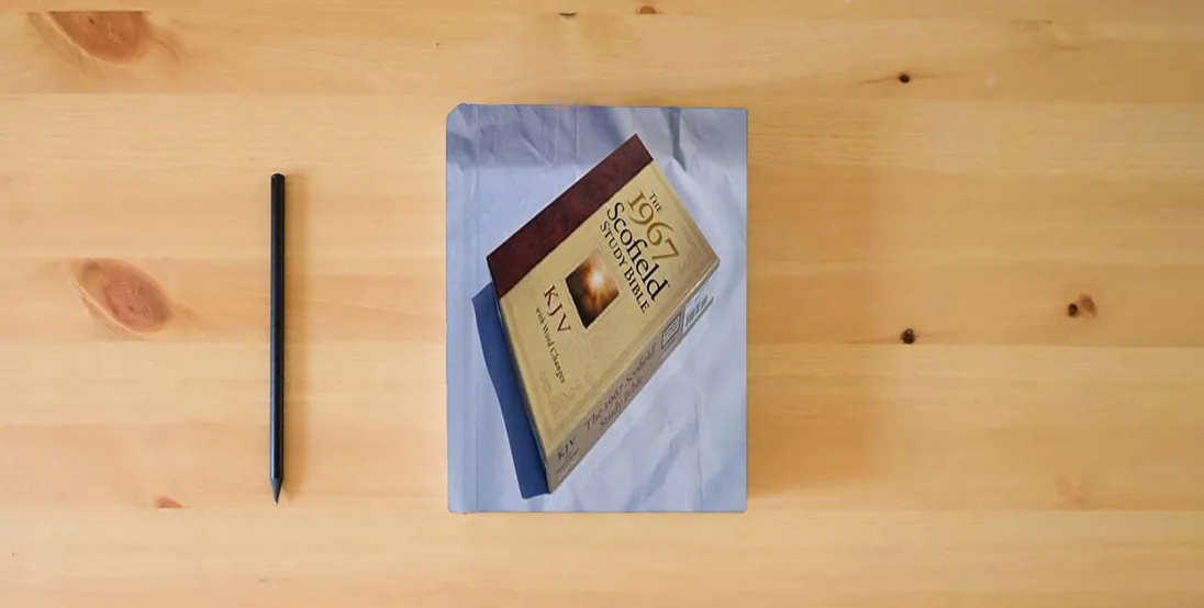 The book The 1967 ScofieldRG Study Bible, KJV, with Word Changes (Black)} is on the table