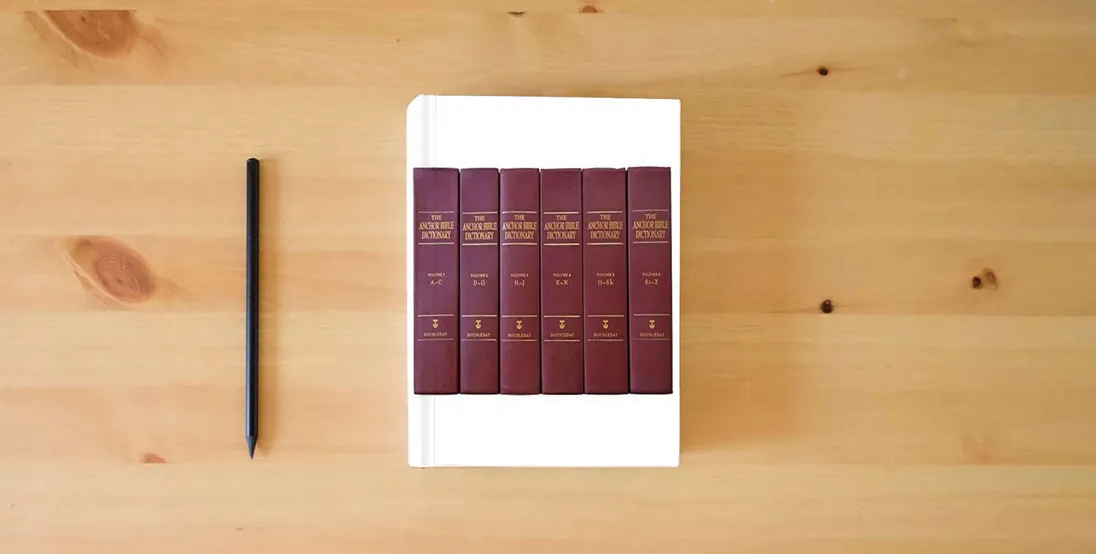The book The Anchor Bible Dictionary (6 Volume Set)} is on the table