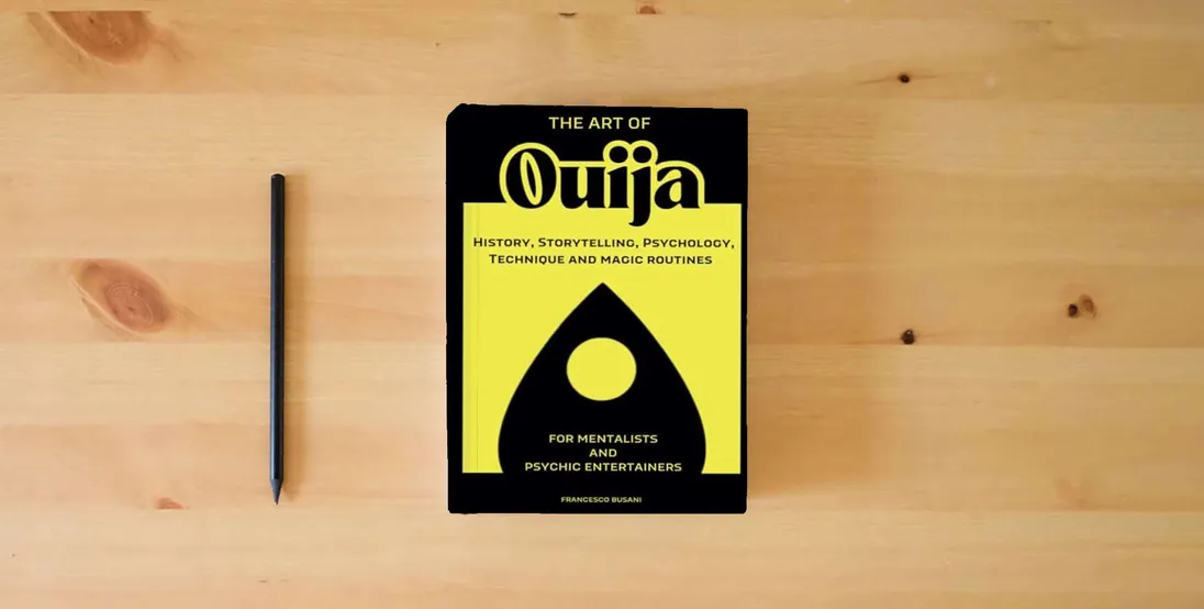 The book The Art of Ouija: history, storytelling, psychology, technique and magic routines} is on the table