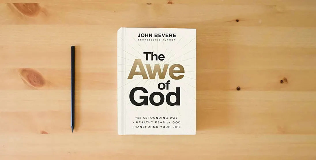 The book The Awe of God: The Astounding Way a Healthy Fear of God Transforms Your Life} is on the table