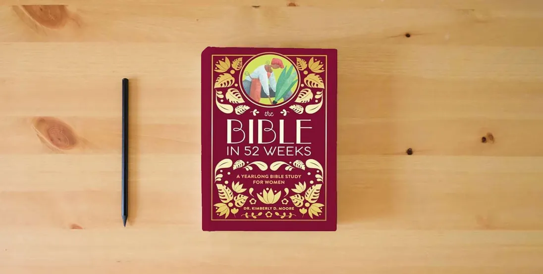 The book The Bible in 52 Weeks (Deluxe Edition): A Yearlong Bible Study for Women} is on the table
