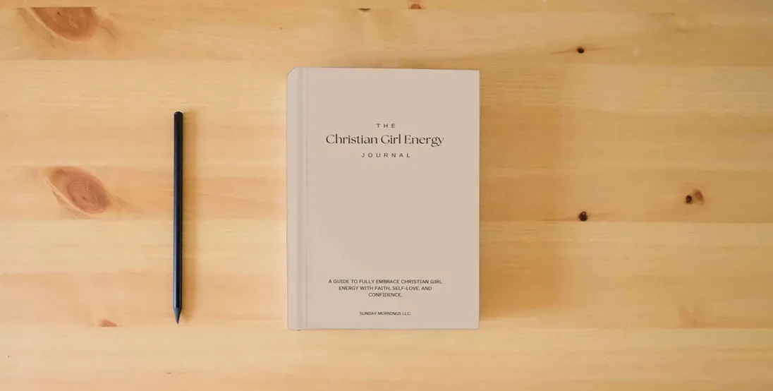 The book The Christian Girl Energy Journal} is on the table