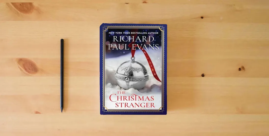 The book The Christmas Stranger} is on the table