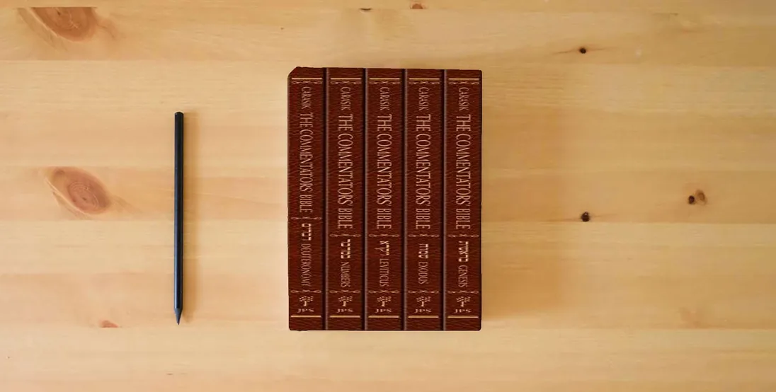 The book The Commentators' Bible, 5-volume set: The Rubin JPS Miqra'ot Gedolot} is on the table