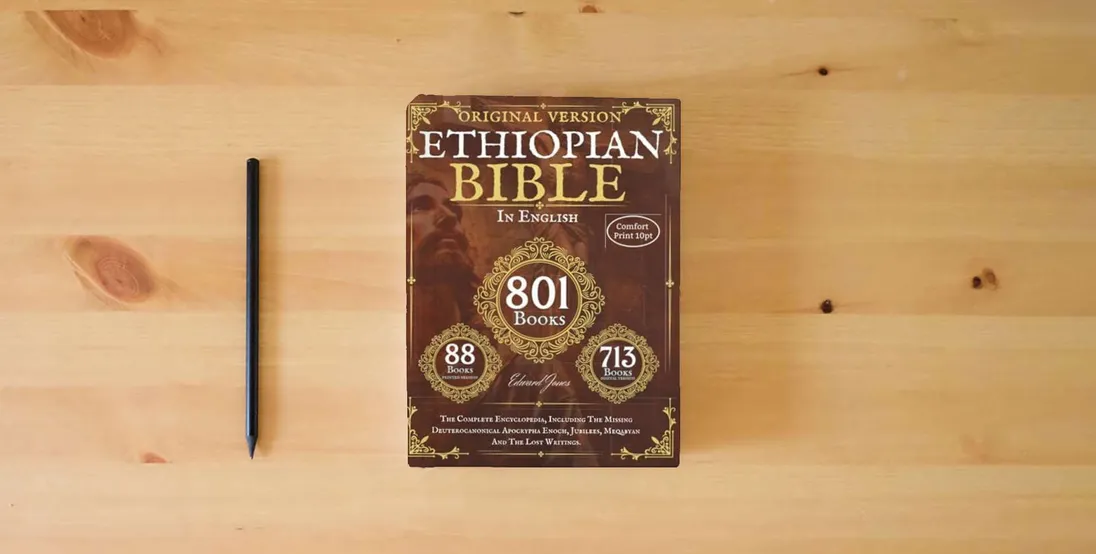 The book The Complete Ethiopian Bible in English - Original version - 88 Books (Comfort Print): The Complete Encyclopedia, Including The Missing ... Jubilees, Meqabyan And The Lost Writings.} is on the table