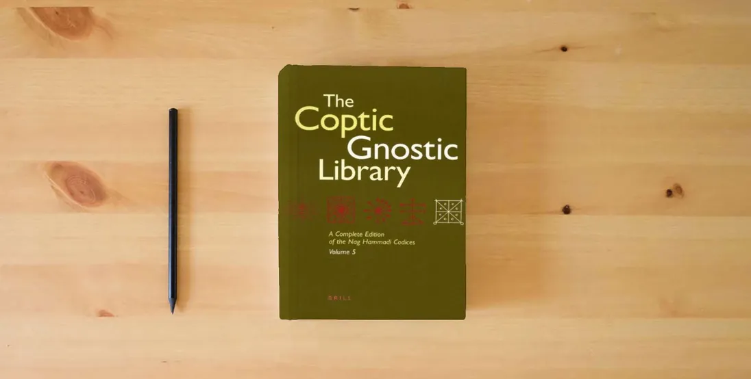 The book The Coptic Gnostic Library: A Complete Edition of the Nag Hammadi Codices ( 5 vol set) (English, Coptic and Coptic Edition)} is on the table