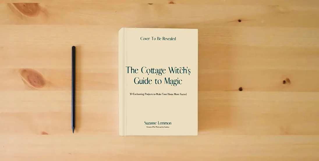 The book The Cottage Witch's Guide to Magic: 30 Enchanting Projects to Make Your Home More Sacred} is on the table