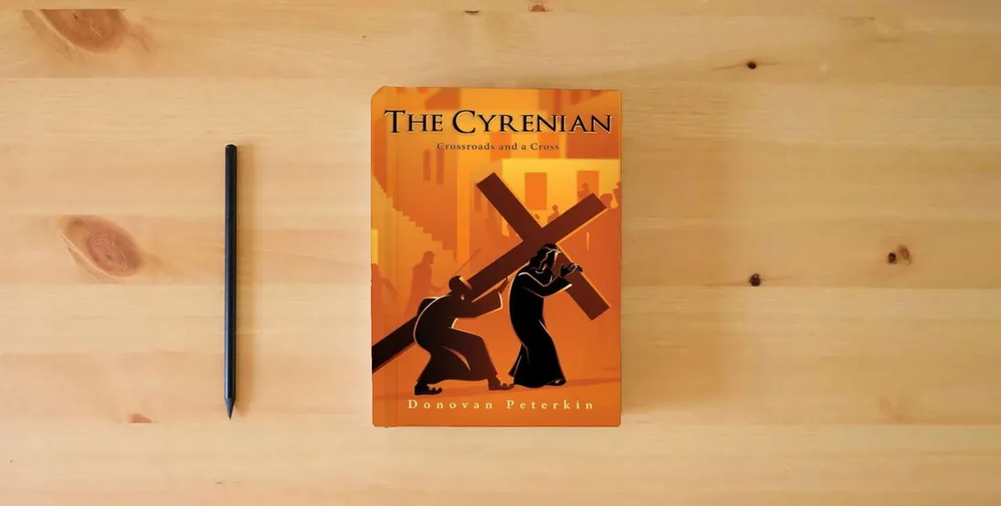 The book The Cyrenian: Crossroads and a Cross} is on the table