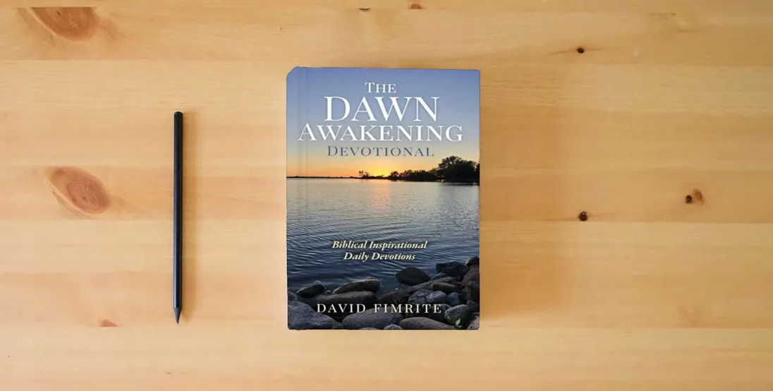 The book The Dawn Awakening Devotional} is on the table