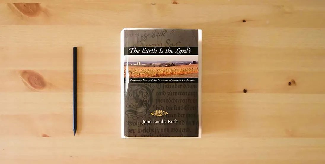 The book The Earth Is the Lord's: A Narrative History of the Lancaster Mennonite Conference} is on the table