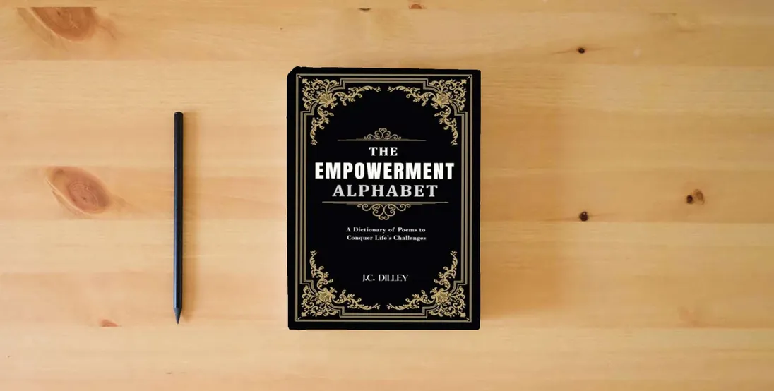 The book The Empowerment Alphabet: A Dictionary of Poems to Conquer Life’s Challenges} is on the table