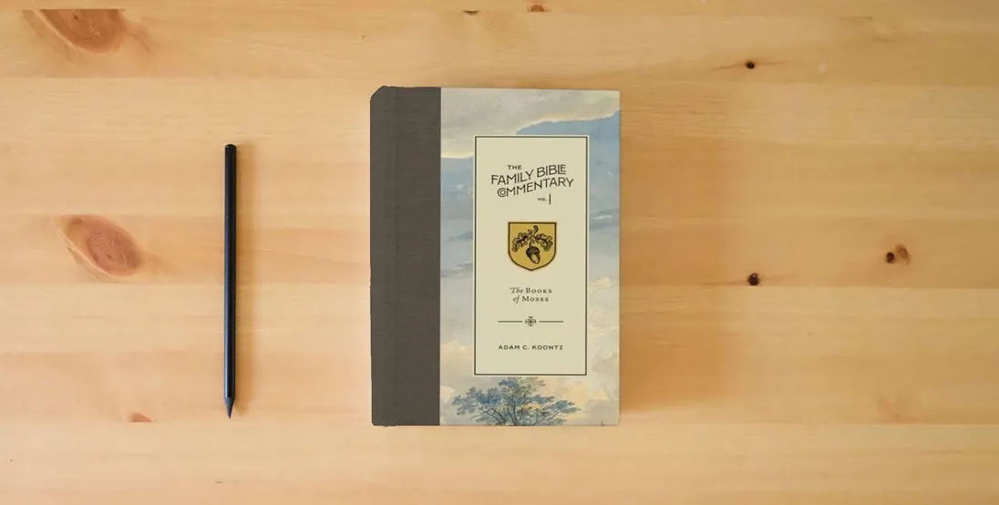 The book The Family Bible Commentary, Vol I: The Books of Moses} is on the table