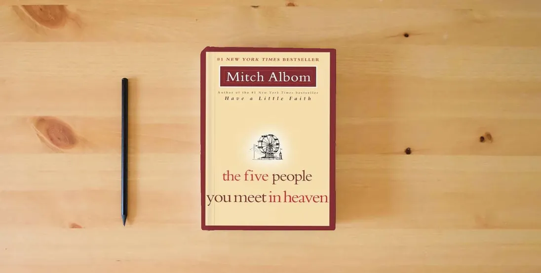 The book The Five People You Meet in Heaven} is on the table