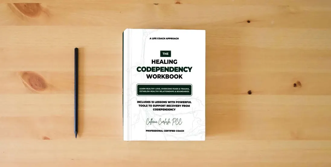 The book The Healing Codependency Workbook: Learn Healthy Love, Overcome Fears & Trauma, Establish Healthy Relationships & Boundaries} is on the table