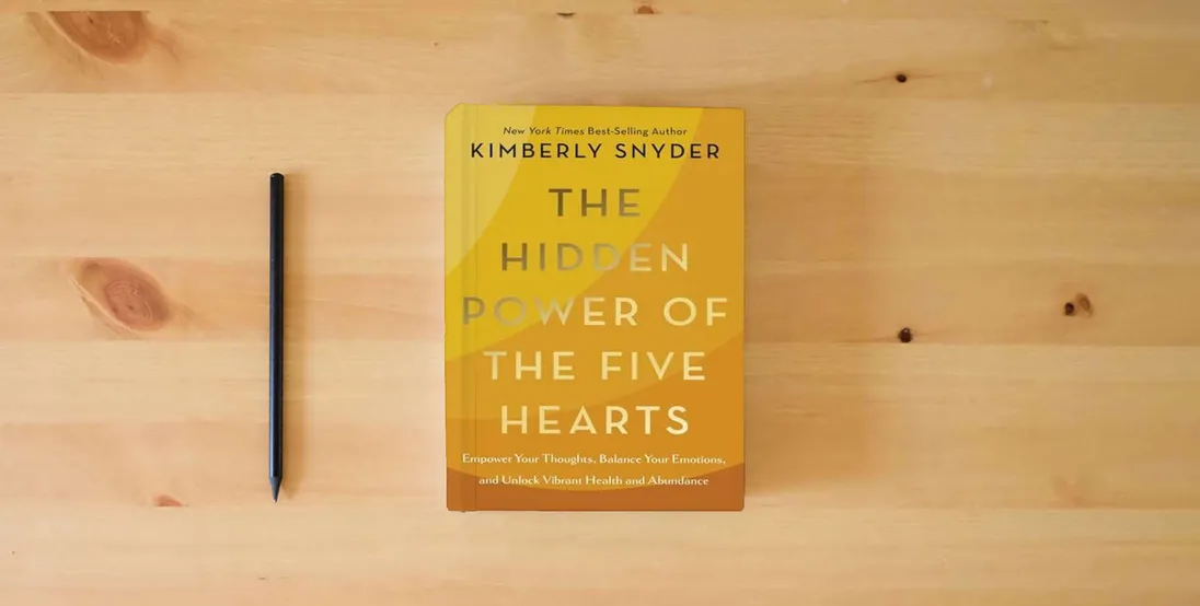 The book The Hidden Power of the Five Hearts: Empower Your Thoughts, Balance Your Emotions, and Unlock Vibrant Health and Abundance} is on the table