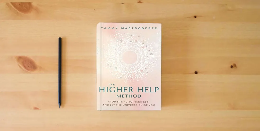 The book The Higher Help Method: Stop Trying to Manifest and Let the Universe Guide You} is on the table