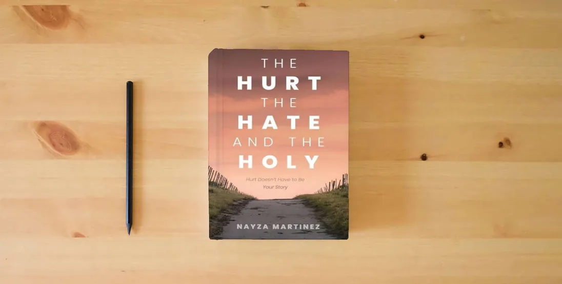 The book The Hurt, The Hate, and The Holy: Hurt Doesn't Have to Be Your Story} is on the table