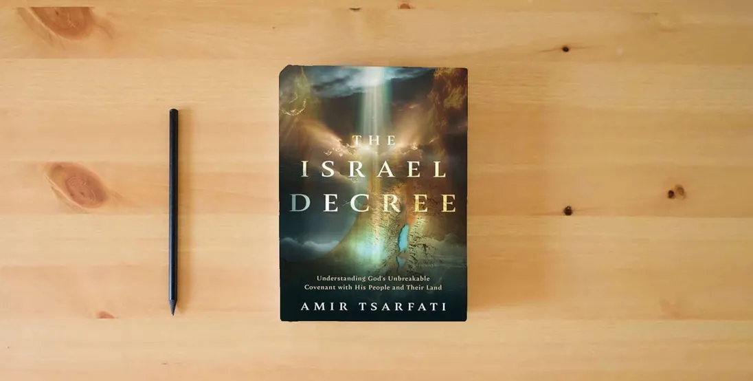 The book The Israel Decree: Understanding God's Unbreakable Covenant with His People and Their Land} is on the table